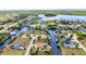 Scenic aerial view of waterfront homes in a tranquil neighborhood with canals for boating and recreation at 4473 Sweetbay St, Port Charlotte, FL 33948