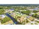 Community aerial view with waterfront properties, private pools, and lush tropical foliage at 4473 Sweetbay St, Port Charlotte, FL 33948