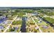 Aerial view captures homes along canals with boat docks, framed by lush vegetation and picturesque waterways at 4473 Sweetbay St, Port Charlotte, FL 33948