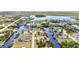 Breath-taking aerial view of a water front residential area offering canal-front living and neighborhood charm at 4473 Sweetbay St, Port Charlotte, FL 33948