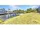 Lush backyard with a private dock, perfect for boating and enjoying waterfront activities at 4473 Sweetbay St, Port Charlotte, FL 33948