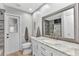 Updated bathroom with modern vanity, walk-in shower, and convenient access door at 4473 Sweetbay St, Port Charlotte, FL 33948