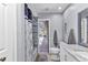 Bathroom featuring walk-in shower and a door leading to the outdoor pool area at 4473 Sweetbay St, Port Charlotte, FL 33948