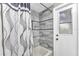 Close-up of tiled walk-in shower with a convenient door to the outside at 4473 Sweetbay St, Port Charlotte, FL 33948
