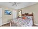 Bright bedroom featuring a decorative wood headboard and a closet for ample storage at 4473 Sweetbay St, Port Charlotte, FL 33948