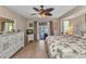 Comfortable bedroom featuring sliding glass doors leading to the pool area at 4473 Sweetbay St, Port Charlotte, FL 33948
