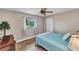 Bedroom showcasing a comfortable bed and a window with natural light at 4473 Sweetbay St, Port Charlotte, FL 33948