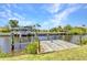 Private dock on the water, ideal for boating and enjoying the serene waterfront views at 4473 Sweetbay St, Port Charlotte, FL 33948