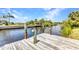 Private dock on the canal with serene views and easy access to waterfront activities at 4473 Sweetbay St, Port Charlotte, FL 33948