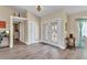 Bright foyer features light wood flooring, a coat closet, and decorative double doors at 4473 Sweetbay St, Port Charlotte, FL 33948