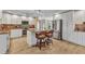 Bright open kitchen with island, stainless steel appliances, and white cabinets at 4473 Sweetbay St, Port Charlotte, FL 33948