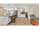 Open-concept kitchen featuring an island with seating and wine storage at 4473 Sweetbay St, Port Charlotte, FL 33948
