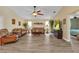 Open living room with hardwood floors, comfortable seating, and natural light at 4473 Sweetbay St, Port Charlotte, FL 33948