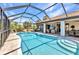 Inviting screened-in pool with outdoor seating, perfect for relaxing and enjoying the Florida lifestyle at 4473 Sweetbay St, Port Charlotte, FL 33948