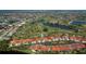 Expansive aerial view of a community on a golf course, showing the home's location and surrounding landscape at 5061 San Rocco Ct, Punta Gorda, FL 33950
