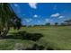 Beautiful backyard overlooking a lush green golf course, perfect for outdoor enjoyment and relaxation at 5061 San Rocco Ct, Punta Gorda, FL 33950