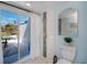 Bathroom features a walk-in shower and sliding glass door to a private outdoor patio at 5061 San Rocco Ct, Punta Gorda, FL 33950