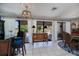 Bright dining room featuring patio access, a chandelier and blue accent rug at 5061 San Rocco Ct, Punta Gorda, FL 33950