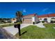 Charming single-Gathering home with a terracotta roof, a well-kept lawn, a mailbox, and a two-car garage at 5061 San Rocco Ct, Punta Gorda, FL 33950