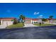 Charming single-story home with a well-maintained lawn, a two-car garage, and a classic exterior at 5061 San Rocco Ct, Punta Gorda, FL 33950