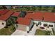 Attractive single-Gathering home with a striking terracotta roof, well-maintained landscaping, and an attached garage at 5061 San Rocco Ct, Punta Gorda, FL 33950