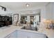 Bright kitchen view features marble countertops and an open layout leading to dining room at 5061 San Rocco Ct, Punta Gorda, FL 33950