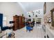 Bright living room features high ceilings, tile floors and view to other living space at 5061 San Rocco Ct, Punta Gorda, FL 33950