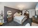 Well-decorated main bedroom with chandelier, dresser, mirrors, and comfortable furnishings at 5061 San Rocco Ct, Punta Gorda, FL 33950