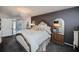 Main bedroom suite with chandelier and views of the bathroom at 5061 San Rocco Ct, Punta Gorda, FL 33950