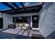 Comfortable outdoor patio showcasing stylish furniture, tasteful decorations, and a welcoming entrance to the home at 5061 San Rocco Ct, Punta Gorda, FL 33950