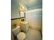 Cozy bathroom with a classic vanity, decorative mirror, and a shower with curtain at 535 Lindley Ter, Port Charlotte, FL 33952