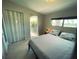 Comfortable bedroom with a cozy bed, access to a balcony, and bright windows at 535 Lindley Ter, Port Charlotte, FL 33952