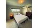 Bedroom with a comfortable bed, dresser, and a sunlit window, creating a relaxing ambiance at 535 Lindley Ter, Port Charlotte, FL 33952