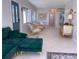 Open-concept living area with stylish furnishings, tile flooring, and ample natural light at 535 Lindley Ter, Port Charlotte, FL 33952