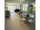 Bright living room with modern furniture and large windows showcasing lush outdoor views at 535 Lindley Ter, Port Charlotte, FL 33952