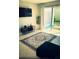 Cozy living space featuring a stylish rug, modern decor, and bright, airy ambiance at 535 Lindley Ter, Port Charlotte, FL 33952