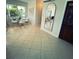 Open-concept living room with tile flooring, a dining area, and ample natural light at 535 Lindley Ter, Port Charlotte, FL 33952