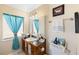 Bathroom featuring wood vanity, granite countertop and cute decor elements at 558 Azalea Drive, Port Charlotte, FL 33952