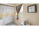 Bathroom featuring shower with curtain, neutral walls, and decor at 558 Azalea Drive, Port Charlotte, FL 33952