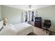 Bedroom featuring neutral carpet, many windows and cozy furnishings at 558 Azalea Drive, Port Charlotte, FL 33952