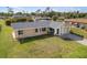 Charming single-story home featuring a well-maintained lawn, attached garage and a screened entrance at 558 Azalea Drive, Port Charlotte, FL 33952