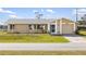 Charming single-story home with a well-maintained lawn and attached garage, perfect for suburban living at 558 Azalea Drive, Port Charlotte, FL 33952