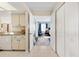 Hallway with view to bedroom and closet featuring tiled floors and neutral walls at 558 Azalea Drive, Port Charlotte, FL 33952