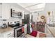Bright kitchen featuring stainless steel appliances and white cabinets at 558 Azalea Drive, Port Charlotte, FL 33952