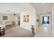 Open concept living room with kitchen, dining area and access to other rooms at 558 Azalea Drive, Port Charlotte, FL 33952