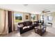 Comfortable living room featuring plush seating, large windows, and neutral tones creating a relaxing atmosphere at 558 Azalea Drive, Port Charlotte, FL 33952
