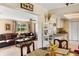 Open living and kitchen area with natural light and warm, inviting decor at 558 Azalea Drive, Port Charlotte, FL 33952