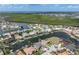 Aerial view of the waterfront homes and community with water access at 571 Port Bendres Dr, Punta Gorda, FL 33950
