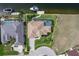 Aerial view of a home with a pool and waterfront access at 571 Port Bendres Dr, Punta Gorda, FL 33950