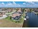 Aerial view of the waterfront property with a private boat dock at 571 Port Bendres Dr, Punta Gorda, FL 33950